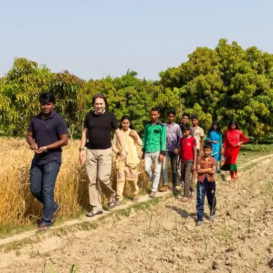 A homestay guest is visiting famous mango garden of Bangladesh