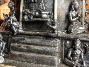 Artisan is constructing a Hindu temple following lost wax method