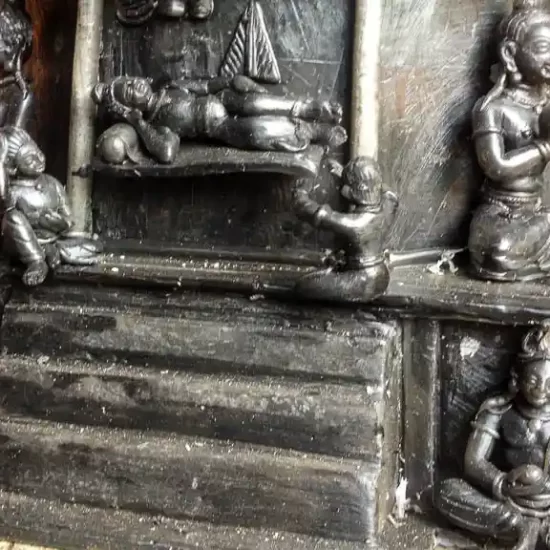 Artisan is constructing a Hindu temple following lost wax method