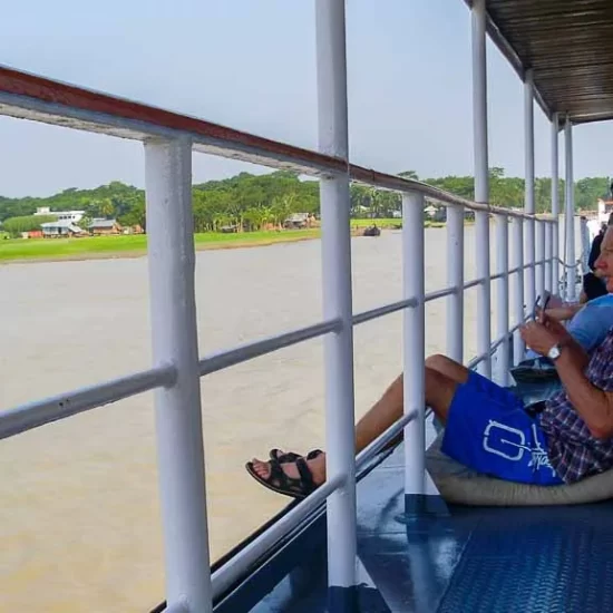 Enjoying the riverine landscape from the boat during the river cruise