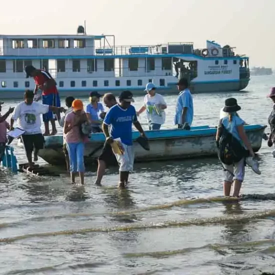 Playing football with locals during the river cruise near dhaka