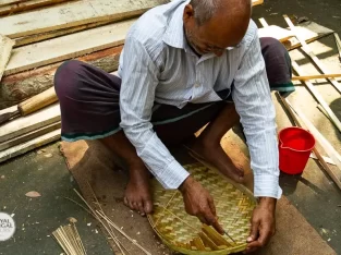 Village artisan at his bamboo craftsmanship in Bangladesh