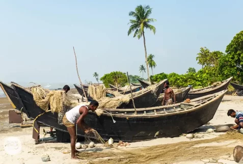 Fishermen are fixing their fishing boats on Kuakata sea beach