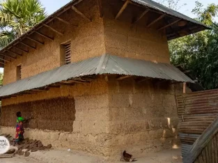 Two story traditional mud house in Bangladesh