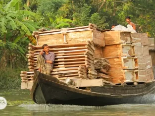 a boat is loaded with huge quantities of furniture