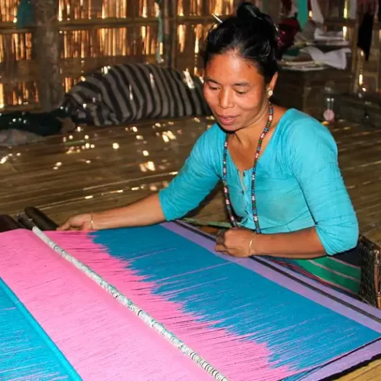 Tripura tribal lady weaving her own dress in Chittagong Hill tra